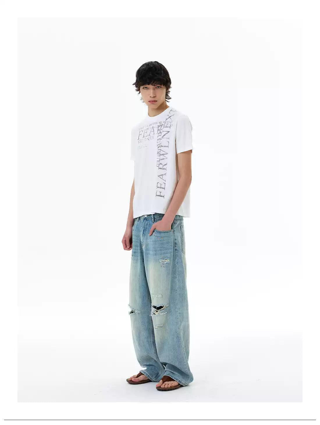 Ripped and Distressed Faded Jeans