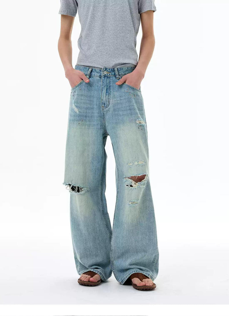 Ripped and Distressed Faded Jeans