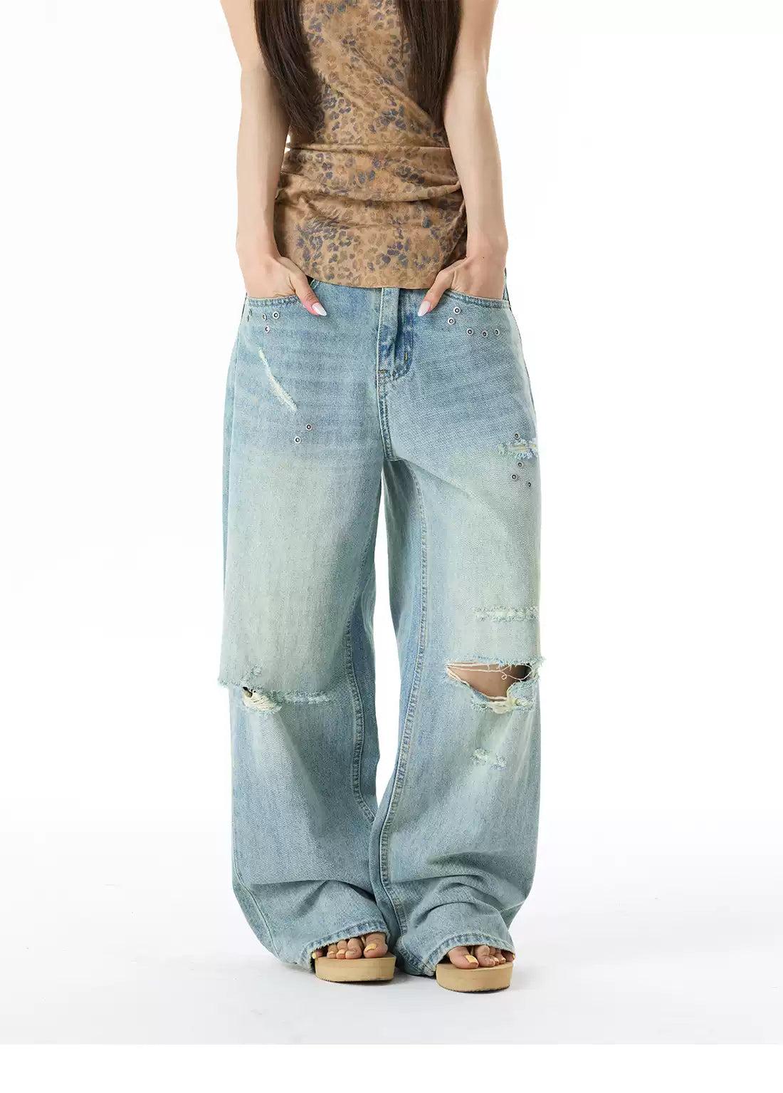 Ripped and Distressed Faded Jeans